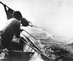 Asahel_curtis__charles_white_in_canoe_get_ready_to_harpoon_a_whale_off_the_coast_of_washington__ca